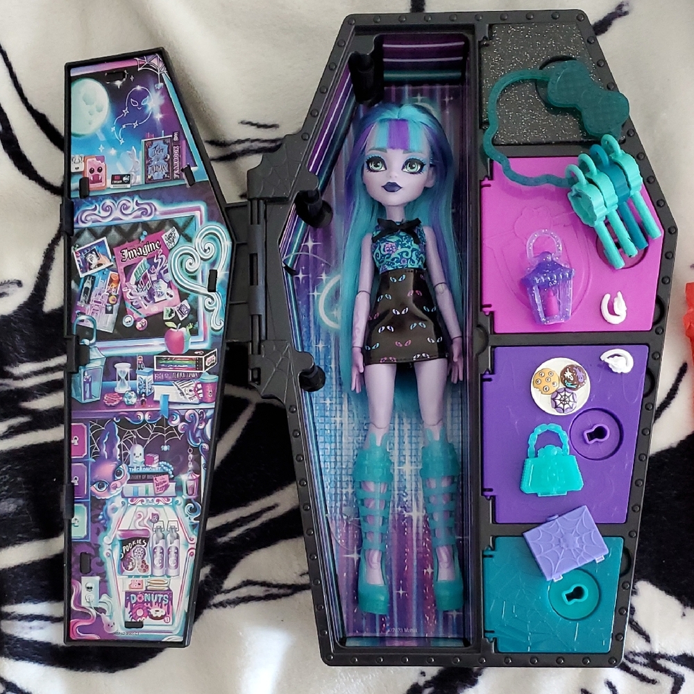 Mattel Doll with Black, Purple, and Teal Accessories